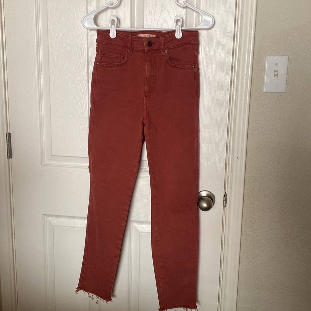 We The Free Skinny Jeans in Rust Red
